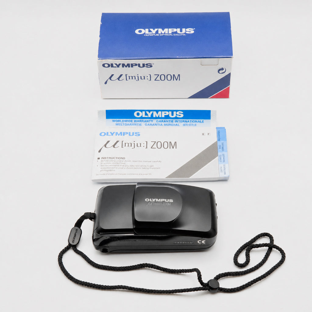 Olympus Mju Zoom complete with original box, instruction manual, warranty card and wrist strap