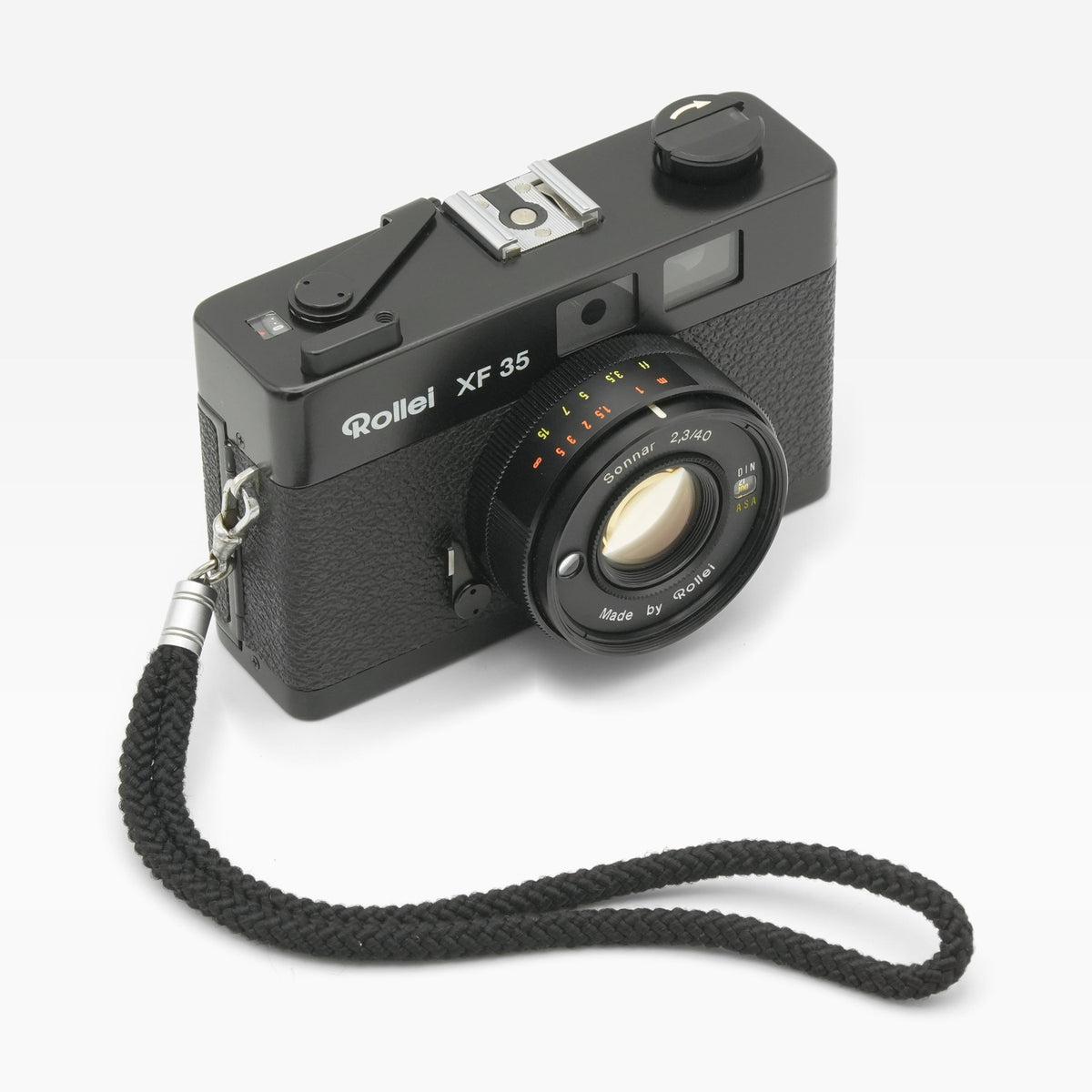 Rollei XF 35 35mm film camera, angled with wrist strap